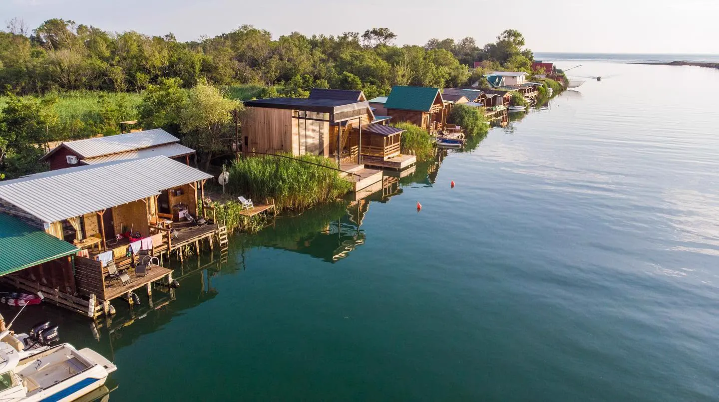 Fishermen’s houses beside the calm Bojana River