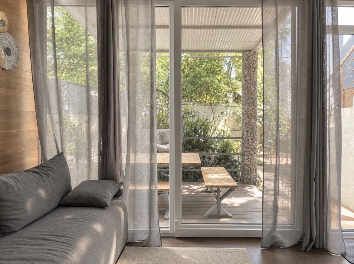 Living room opening onto a private garden terrace